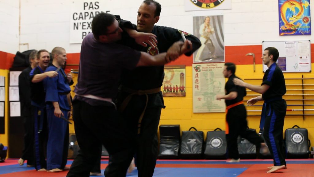 Adults Shaolin Kempo Karate class. Defense technique and pricipals agains knife attack.